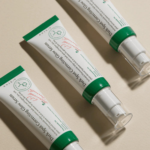Two tubes of Darphin Skin Care Cream on a beige background