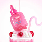 Pink bottle with a dropper labeled 'Equal Berry' on top of a dessert with whipped cream and cherries.