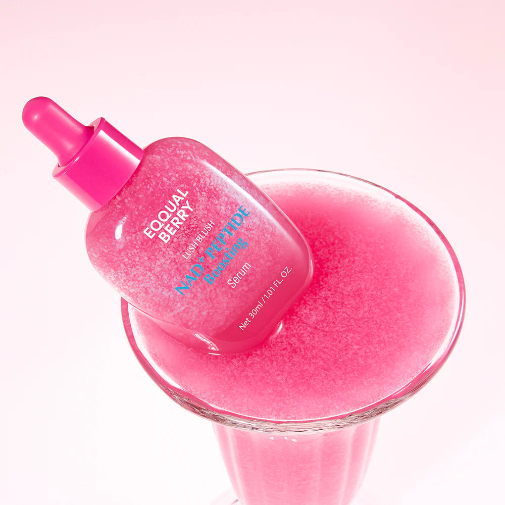 Pink skincare serum bottle with dropper on a pink background