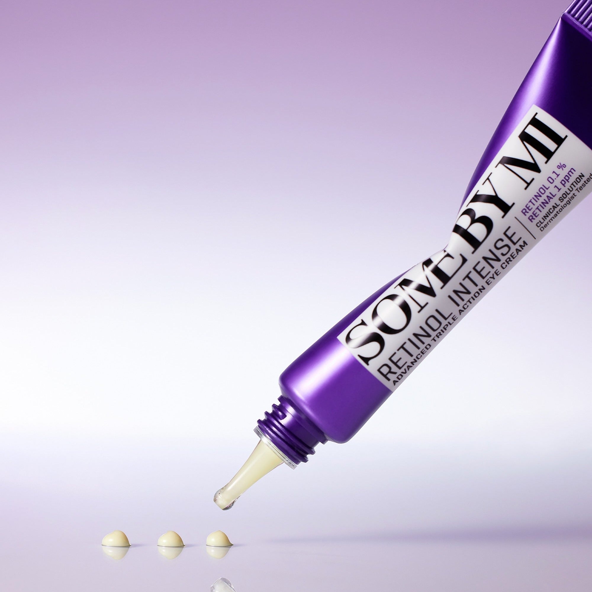 Purple tube of 'Solve by M.' with a dropper on a reflective surface and gradient background