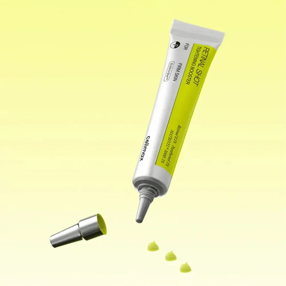 Skincare product tube with applicator on a yellow background