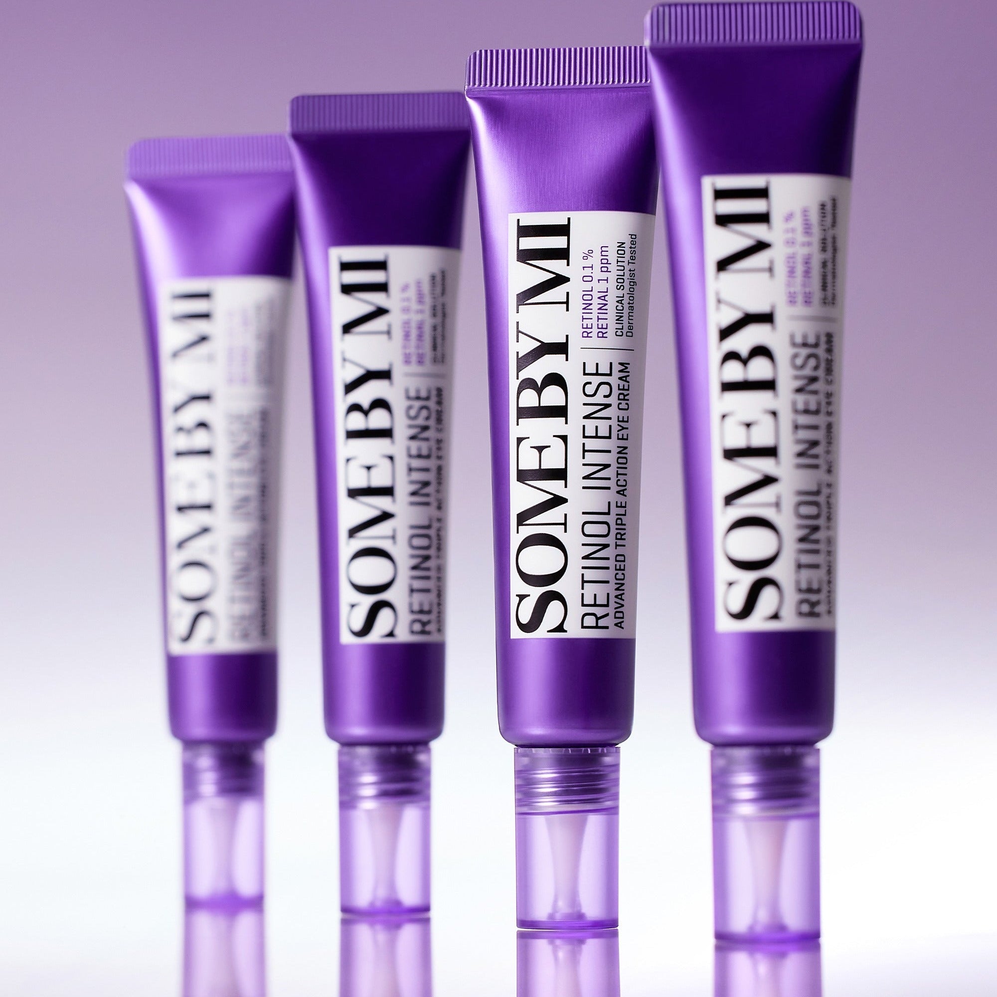Three tubes of 'Some by Mi' Retinol Intense serum on a gradient purple background