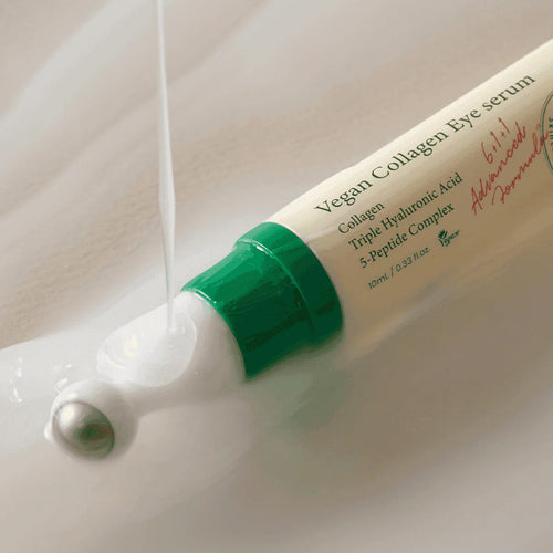 Vegan Collagen Eye serum with green cap and white body on a light background